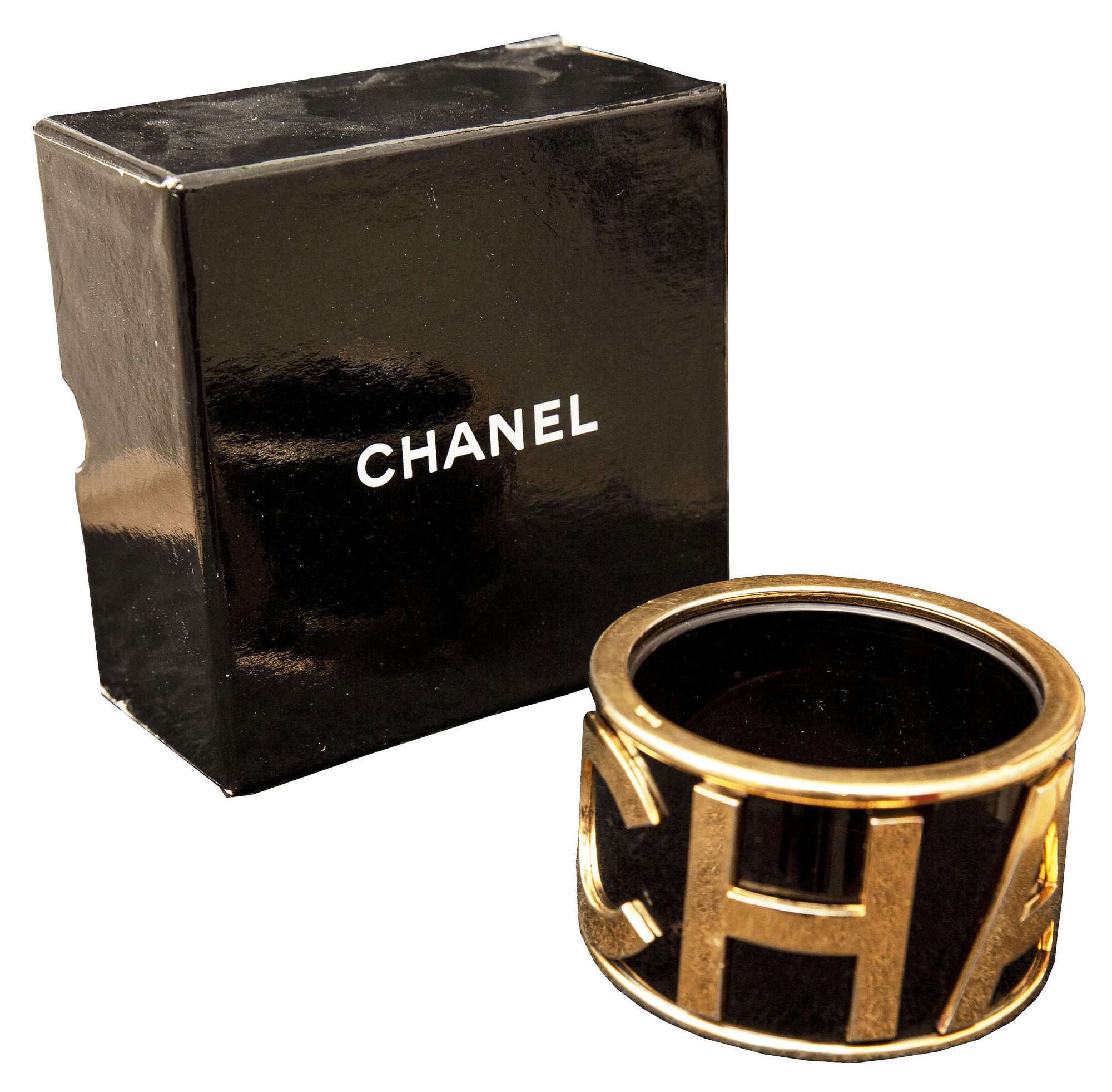 Chanel BRACELET Description: Iconic rigid bracelet with large golden Chanel...
