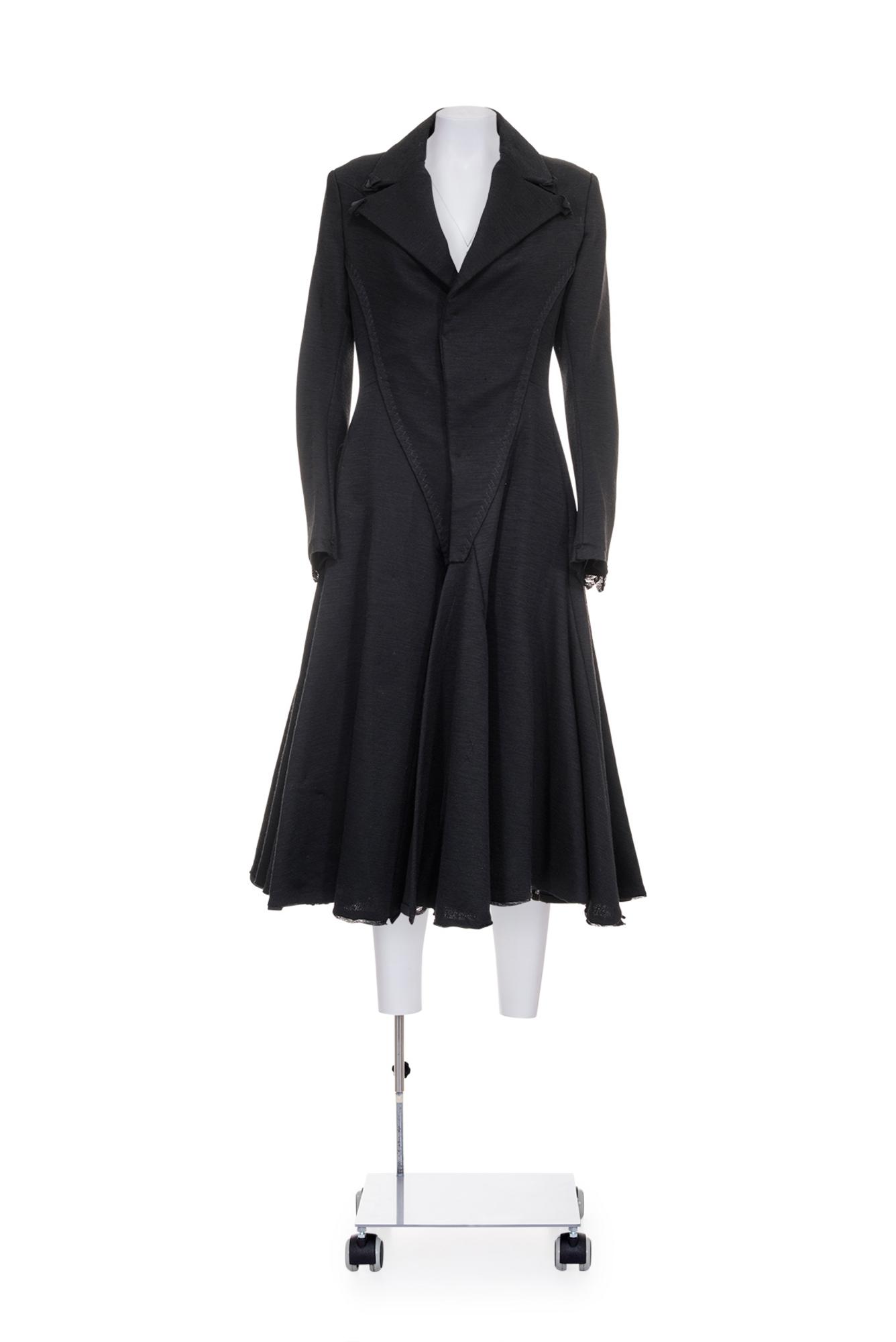 YOHJI YAMAMOTO Wool jersey redingote coat DESCRIPTION: Black wool jersey...