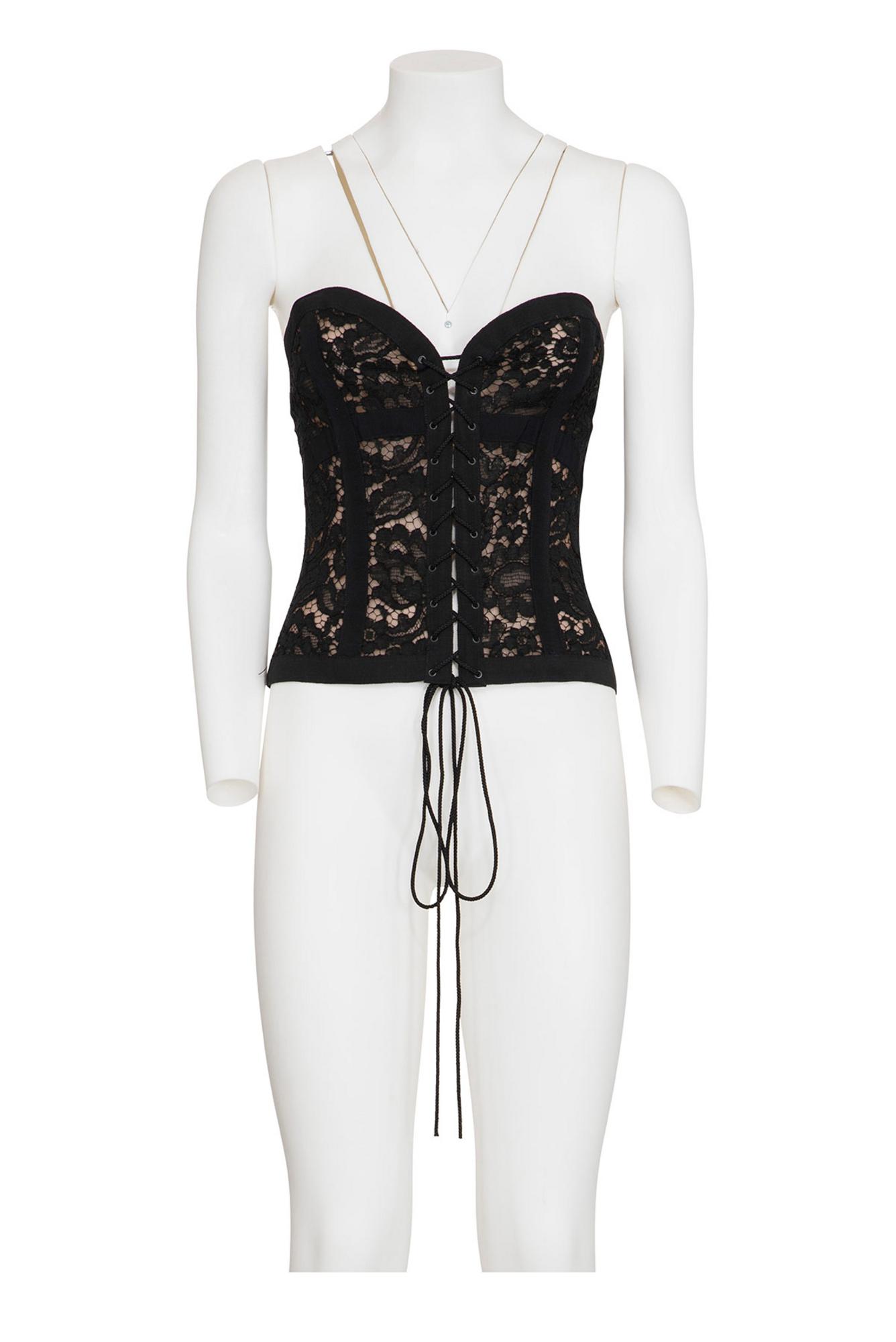 YVES SAINT LAURENT Lace and silk corsage with whalebones DESCRIPTION: Black...