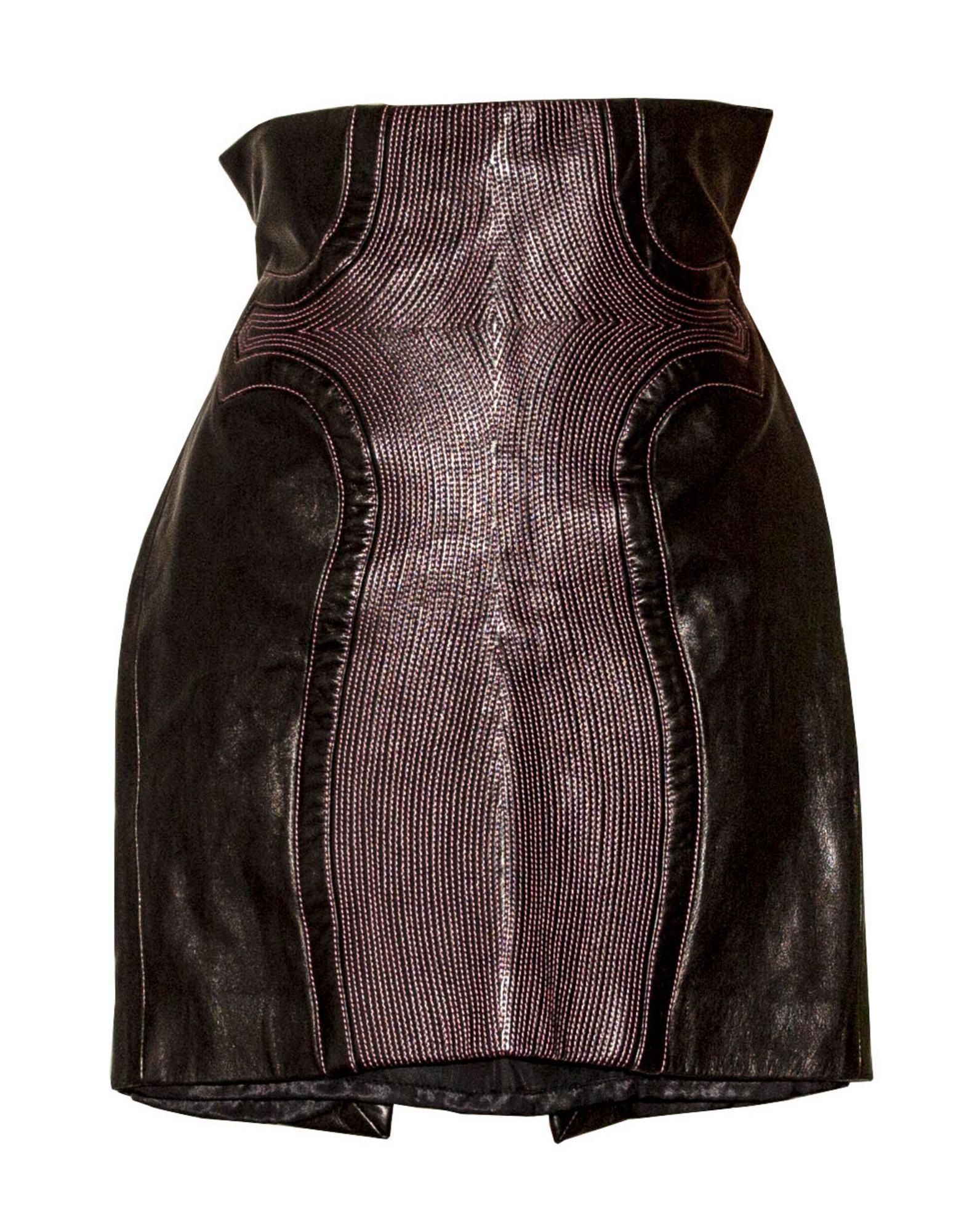 Versace LEATHER SKIRT Description: Black leather skirt with pink top...