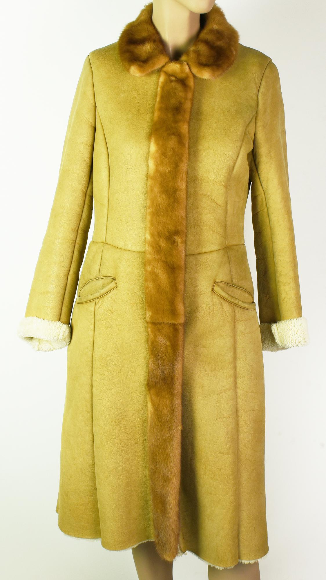 Prada FUR COAT Description: Lined sheepskin coat. Mink collar. 2 pockets....