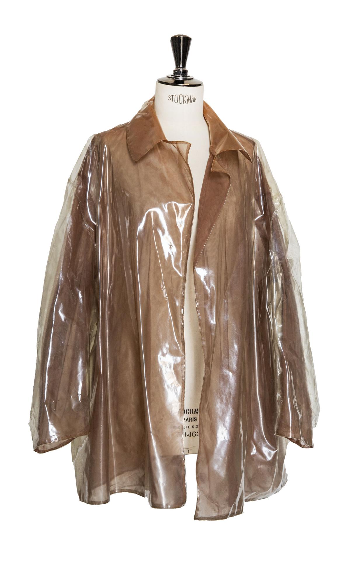 Helmut Lang BLADE RAINCOAT Description: Raincoat in transparent pvc lined...