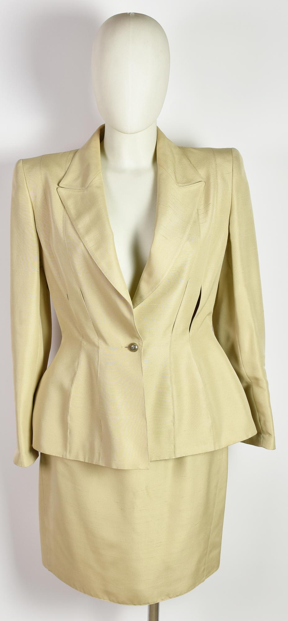 Claude Montana TAILLEUR DESCRIPTION: Beige suit consisting of jacket and...