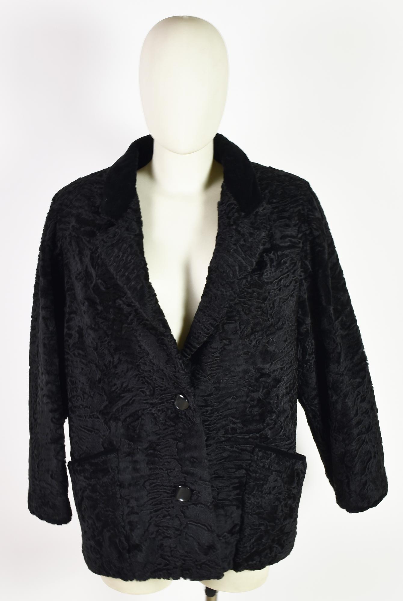 ASTRAKAN FUR DESCRIPTION: Artisanal Astrakan fur with black velvet details....