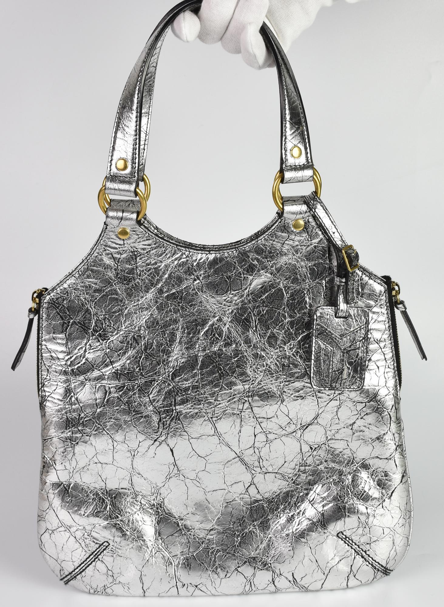 Yves Saint Laurent METROPOLIS BAG DESCRIPTION: Silver leather tote bag with...