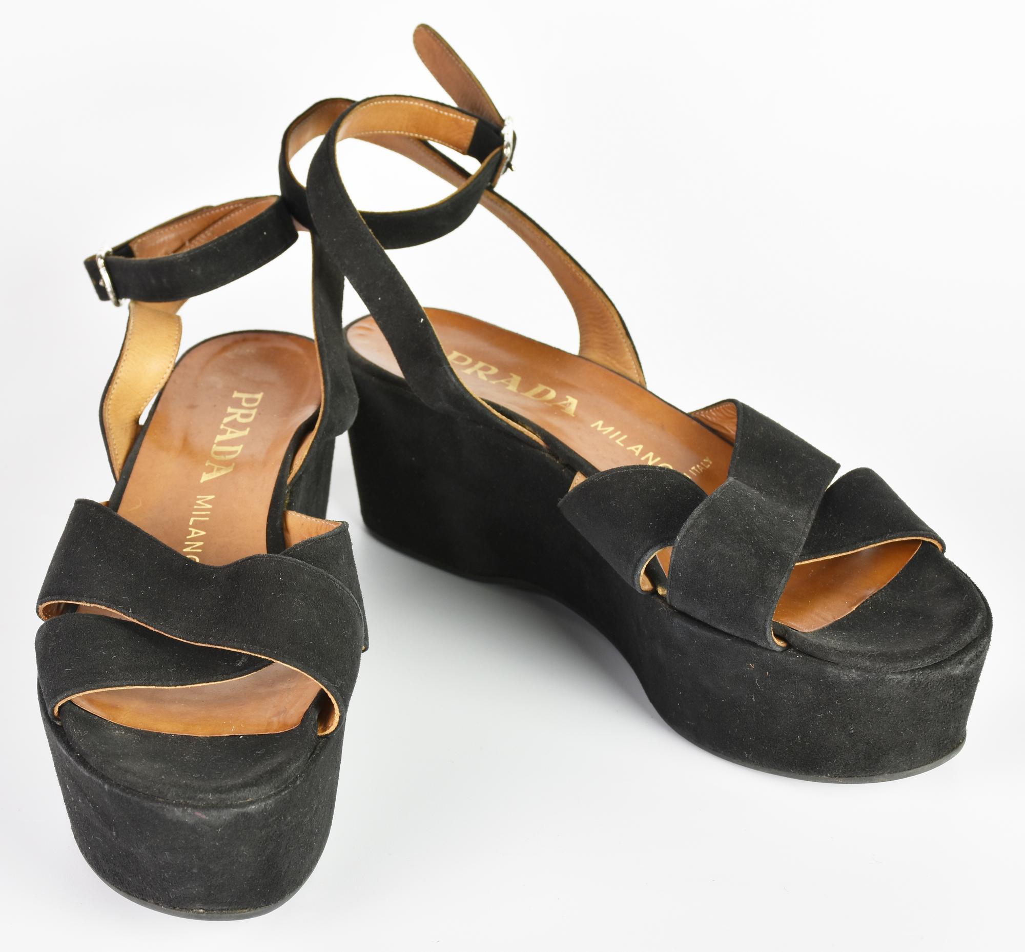 Prada WEDGE SANDALS DESCRIPTION: Black suede platform sandal with ankle...