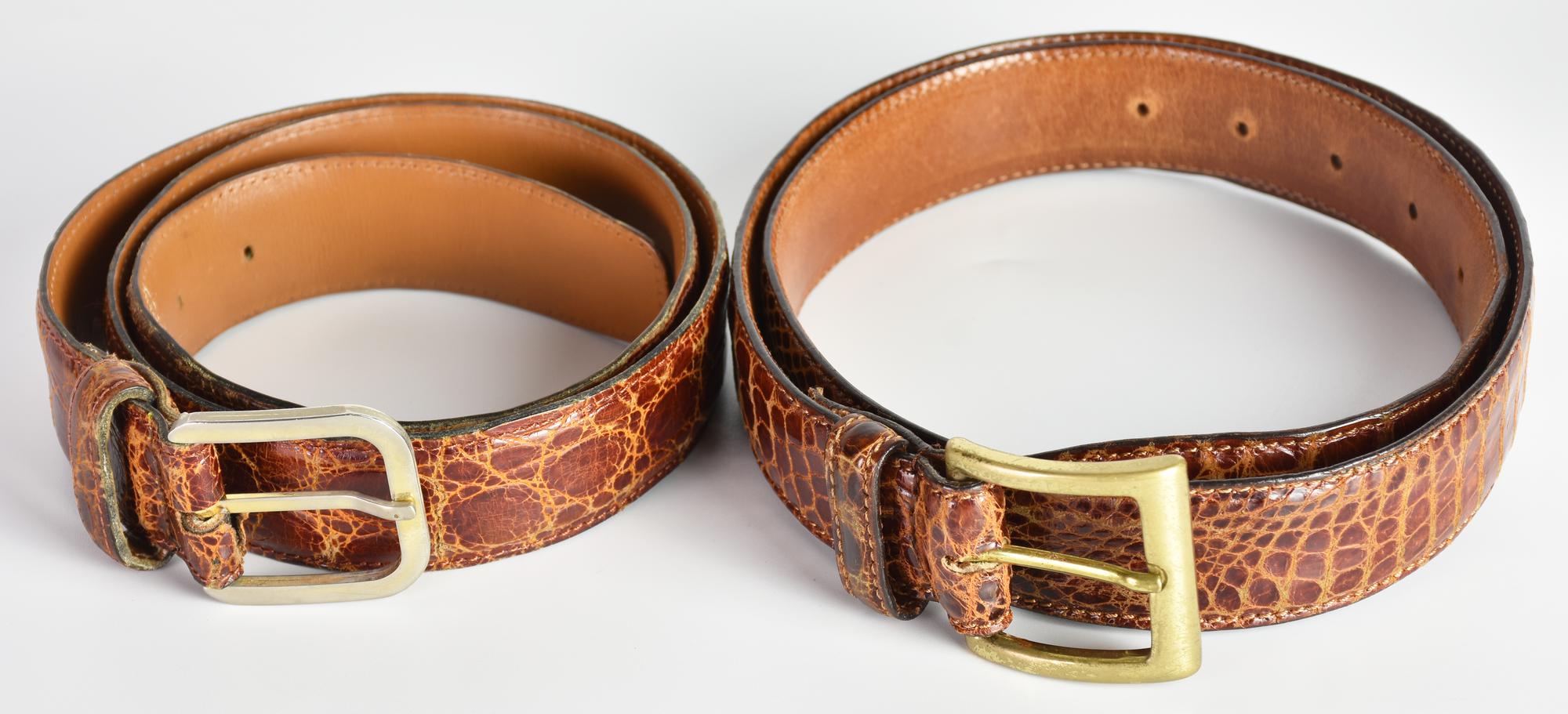 CROCODILE BELTS DESCRIPTION: A pair of crocodile leather belts. Made in...