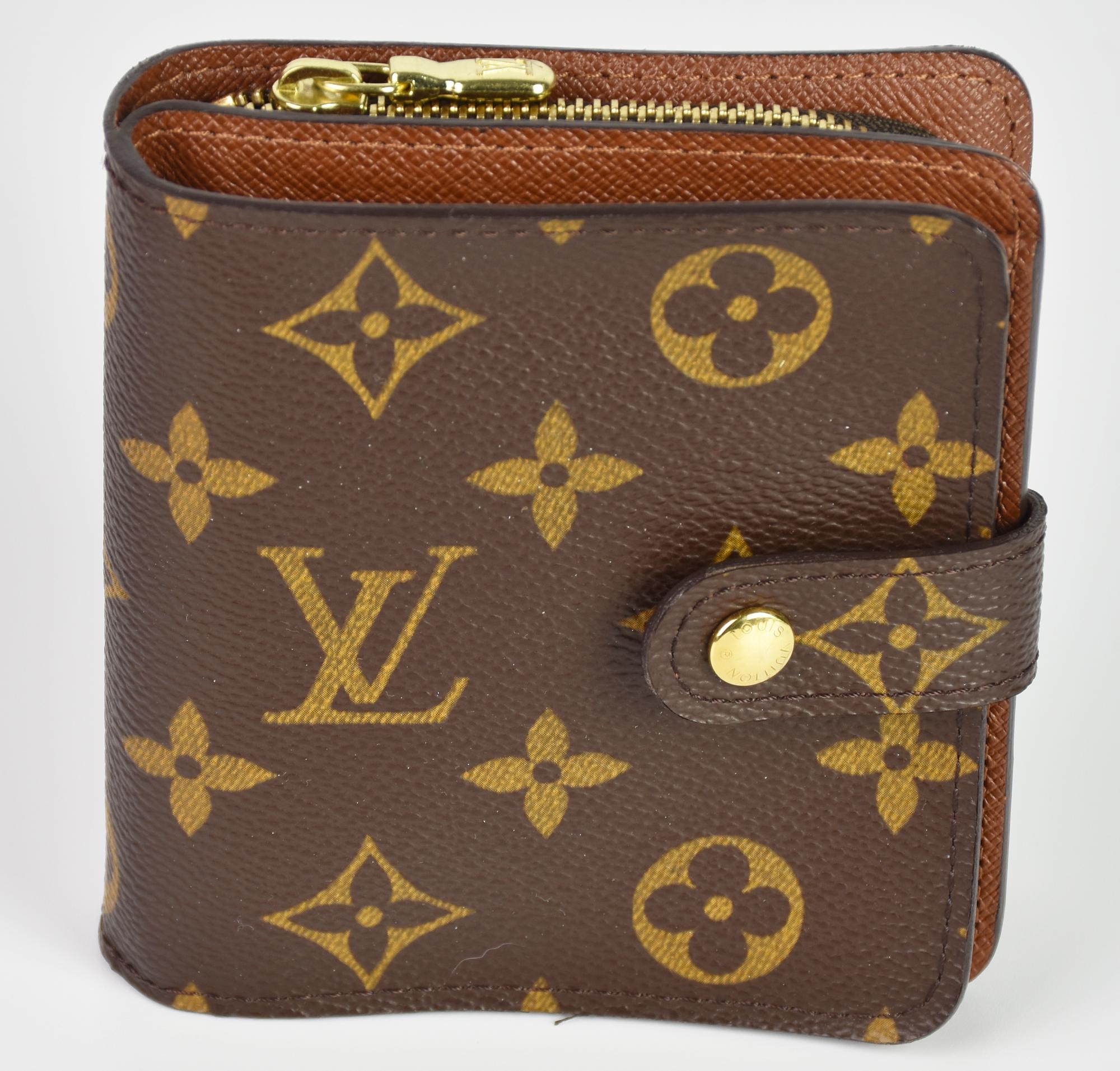 Louis Vuitton COMPACT ZIPPY MONOGRAM CANVAS WALLET DESCRIPTION: Monogram...