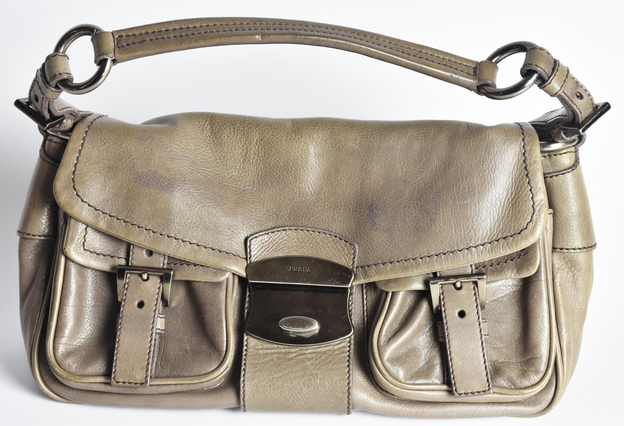 Prada BAGUETTE LEATHER BAG DESCRIPTION: Leather shoulder bag with snap...