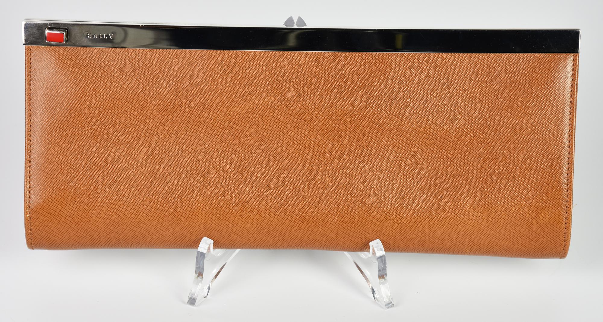 Bally CLUTCH DESCRIPTION: Brown leather baguette bag with metal detail....