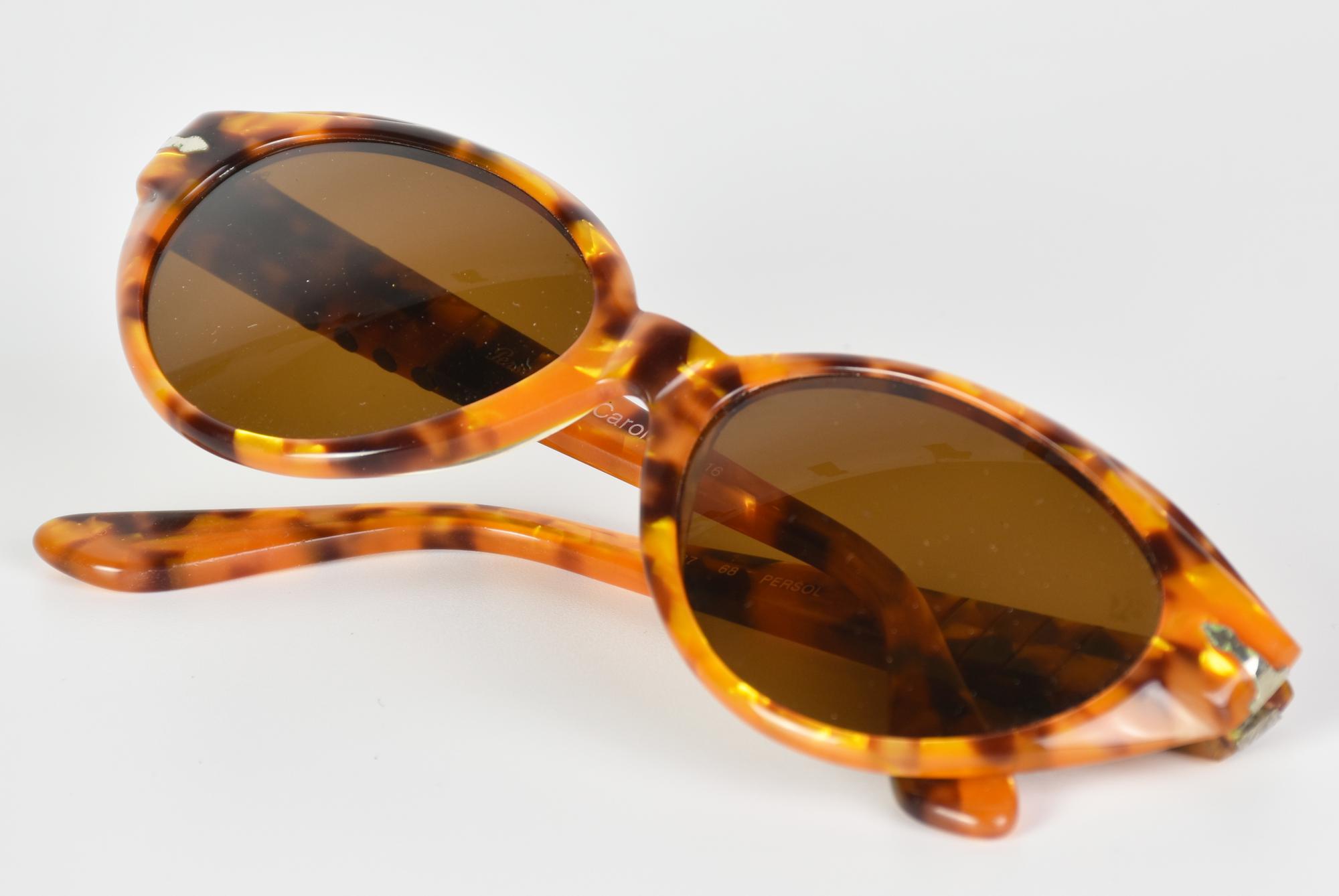 Persol SUNGLASSES DESCRIPTION: Persol tortoiseshell sunglasses with details...