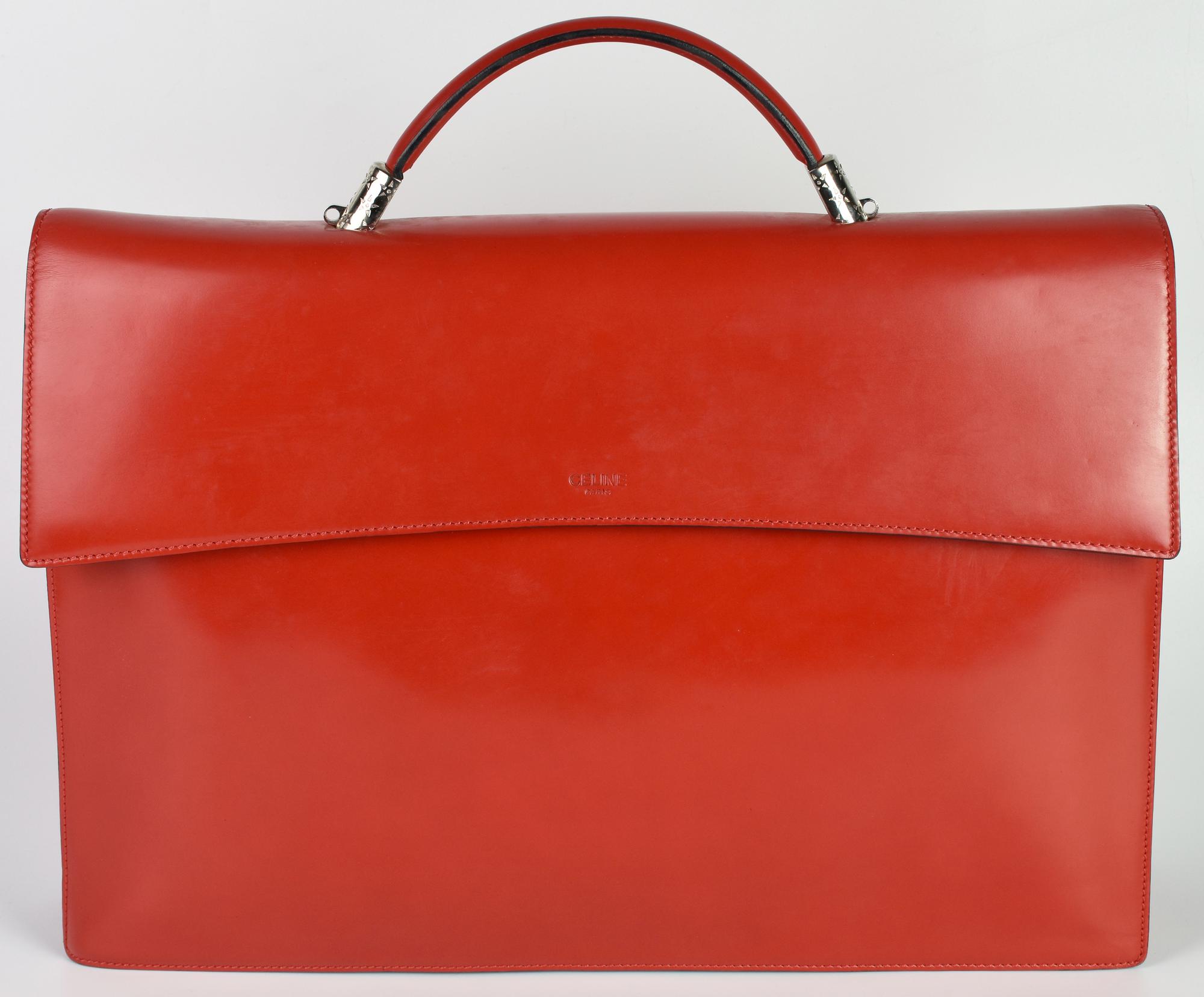 Celine BRIEFCASE DESCRIZIONE: Red leather briefcase with handle and magnetic...