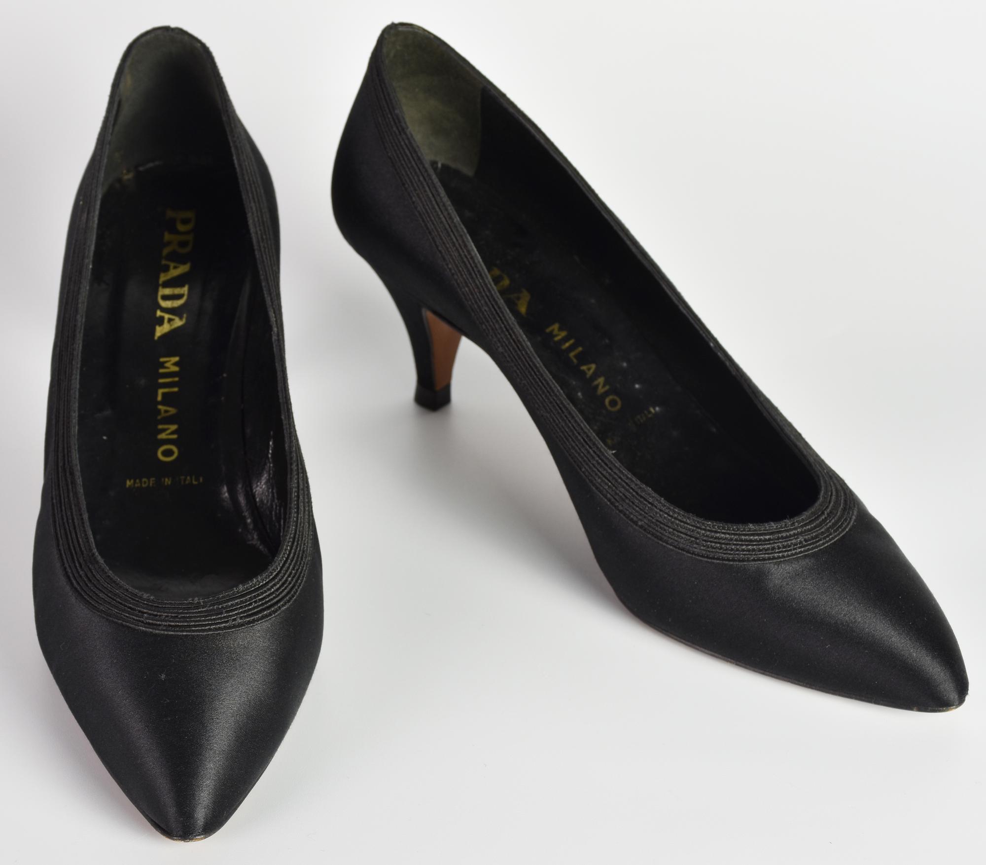 Prada SHOES DESCRIPTION: Decolletee shoes in black satin and matching...