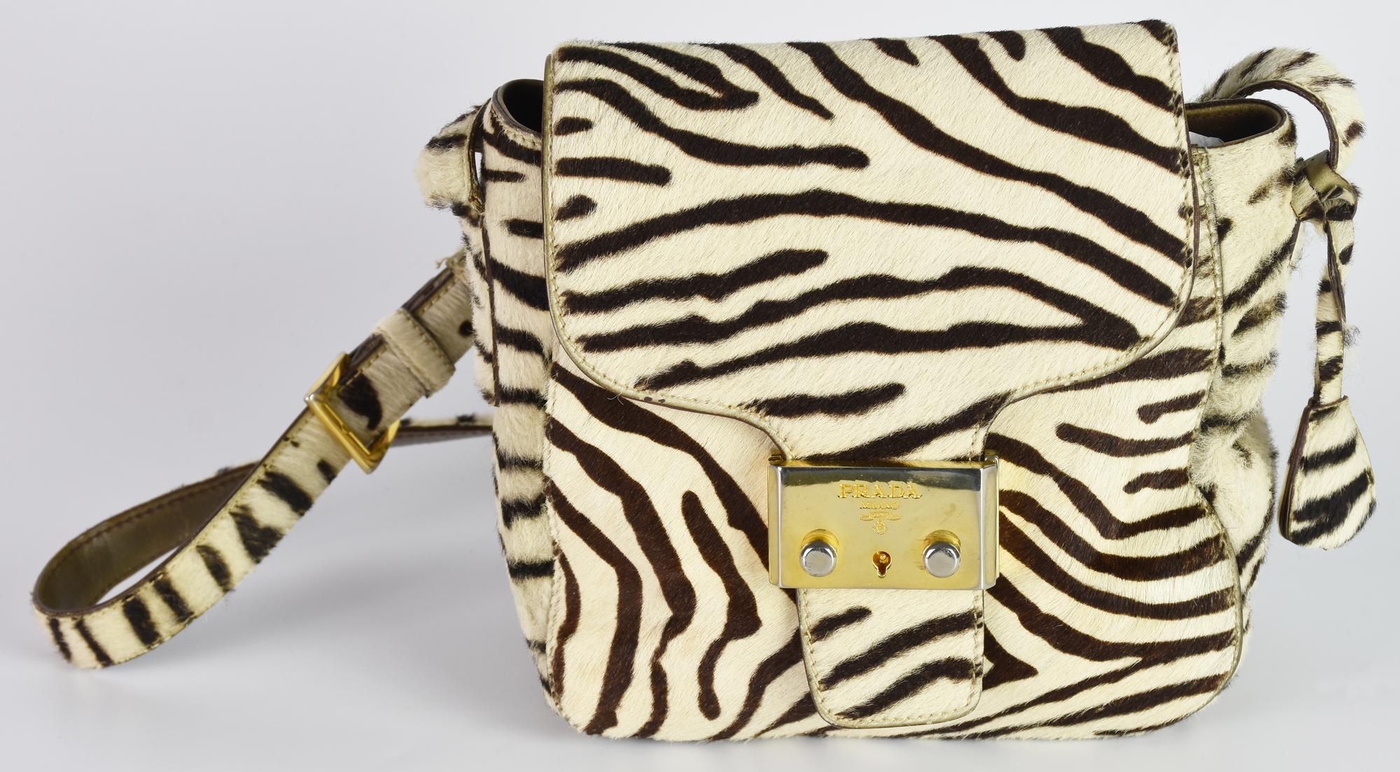 Prada SHOULDER BAG DESCRIPTION: Zebra print shoulder bag. Flap closure with...