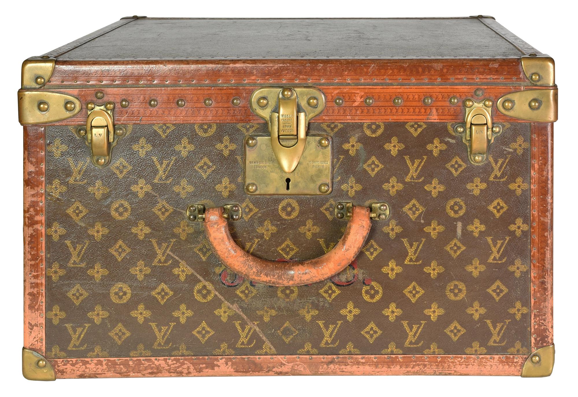 Louis Vuitton MALLE DESCRIPTION: Vintage wooden travel trunk, covered in...