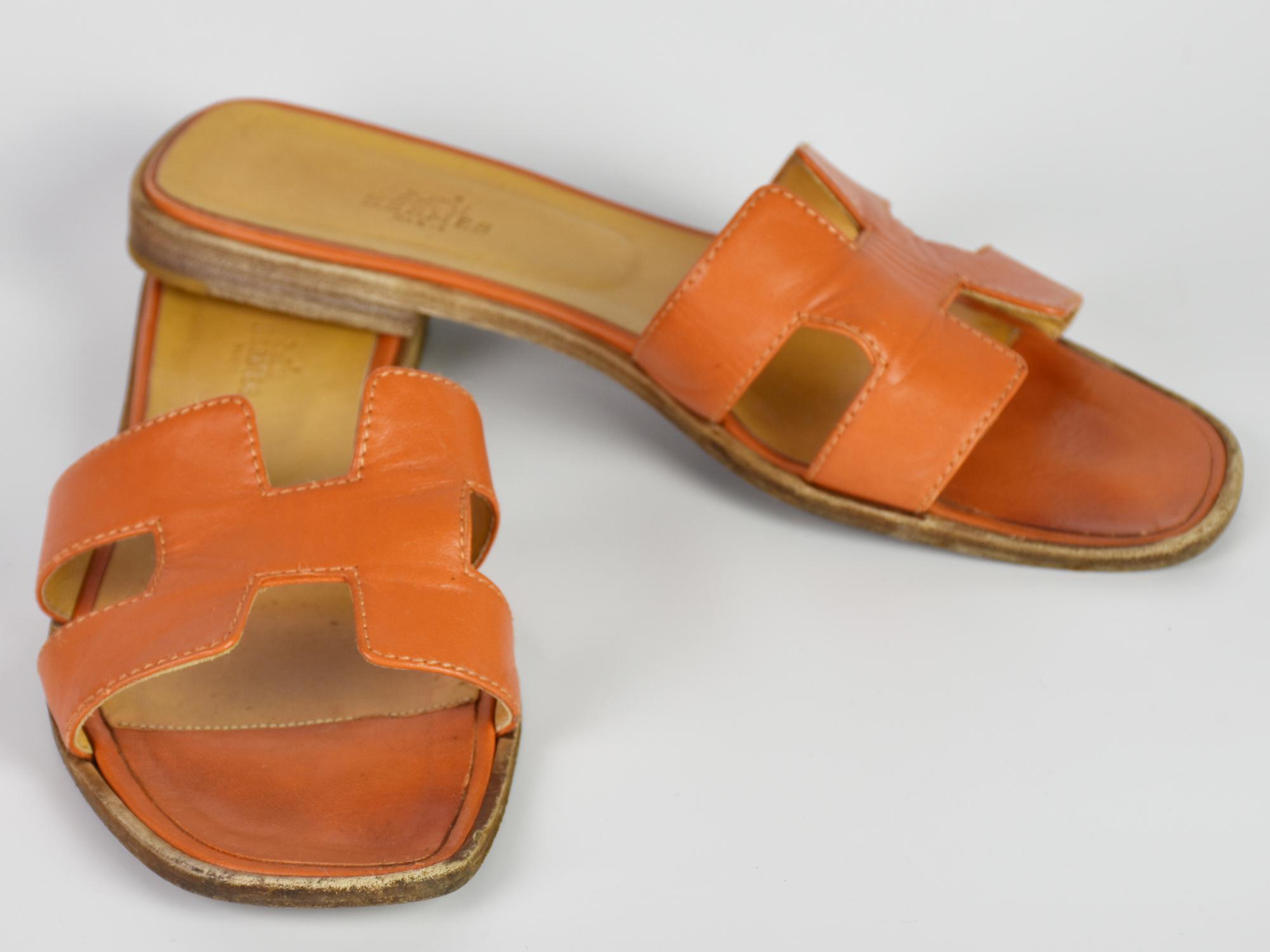 Hermes ORAN SANDAL DESCRIPTION: Iconic orange leather sandal. With original...