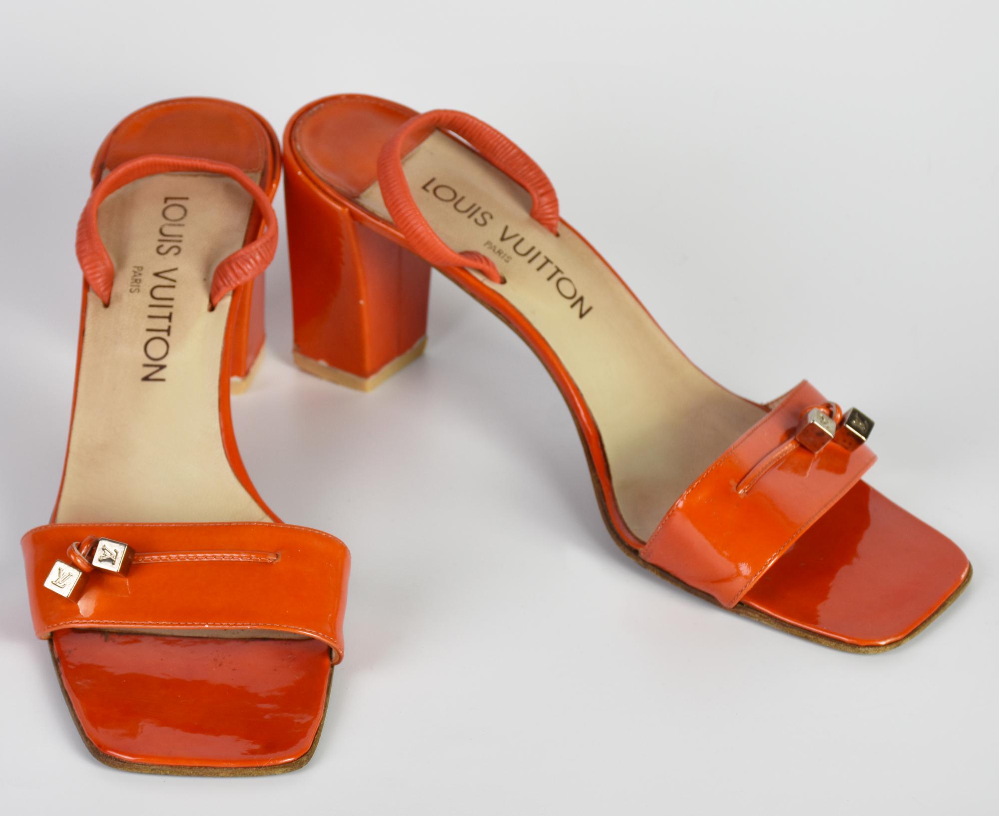 Louis Vuitton SLINGBACK SANDALS DESCRIPTION: Orange patent leather slingback...