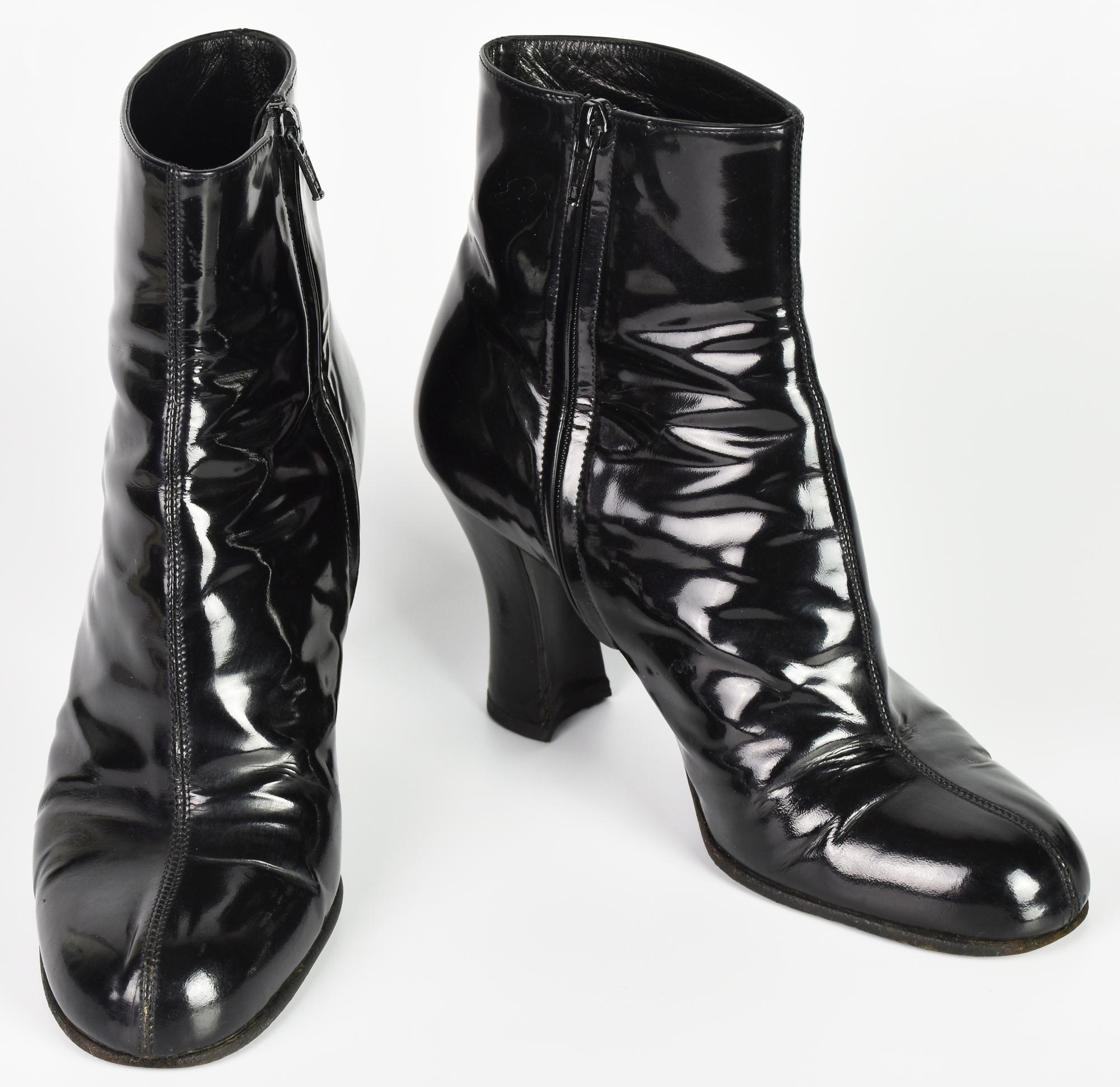 Prada ANKLE BOOTS DESCRIPTION: Victorian-style black patent leather ankle...