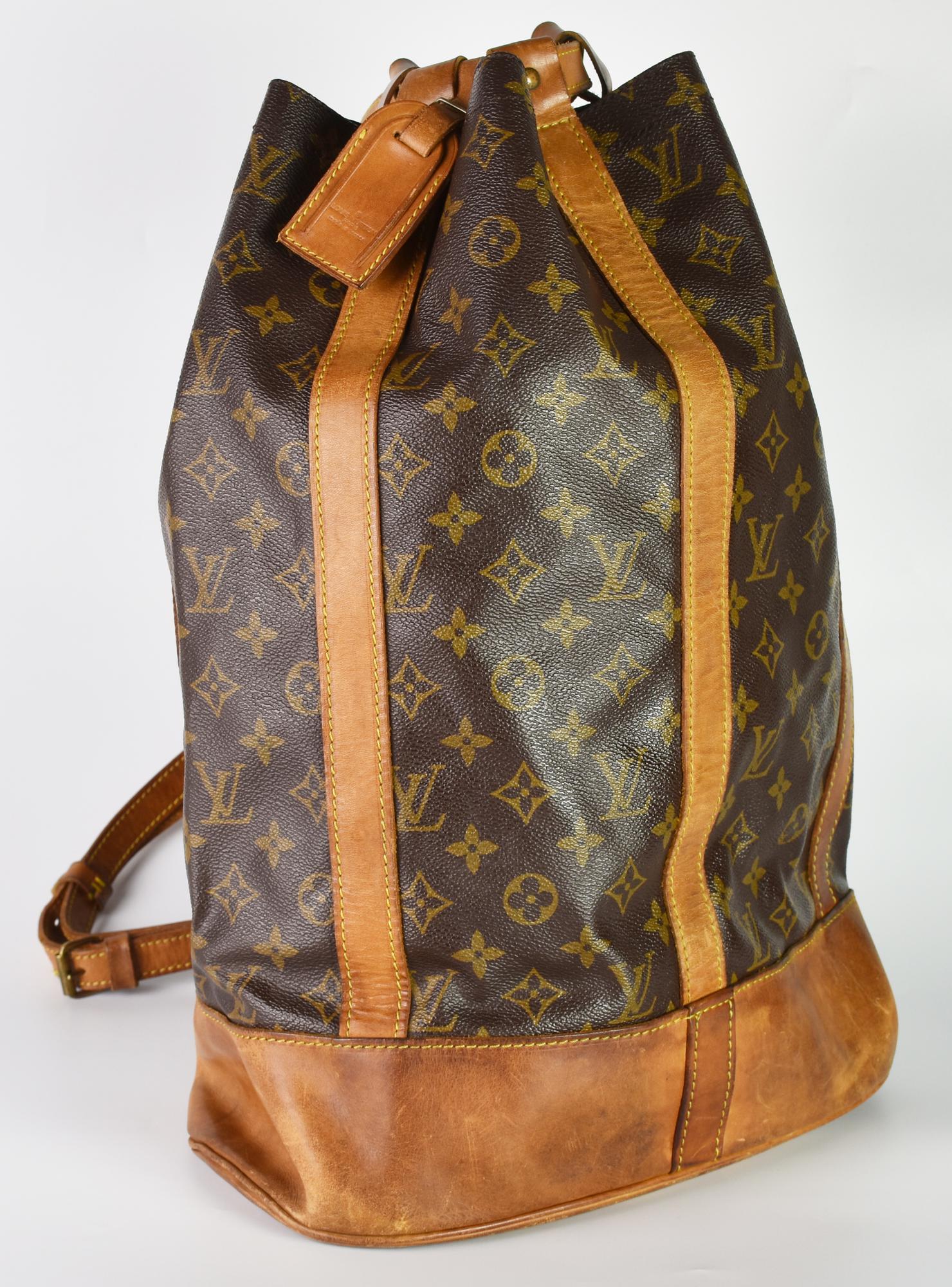 Louis Vuitton SAC RANDONNEE DESCRIPTION: Randonnee crossbody bag in monogram...