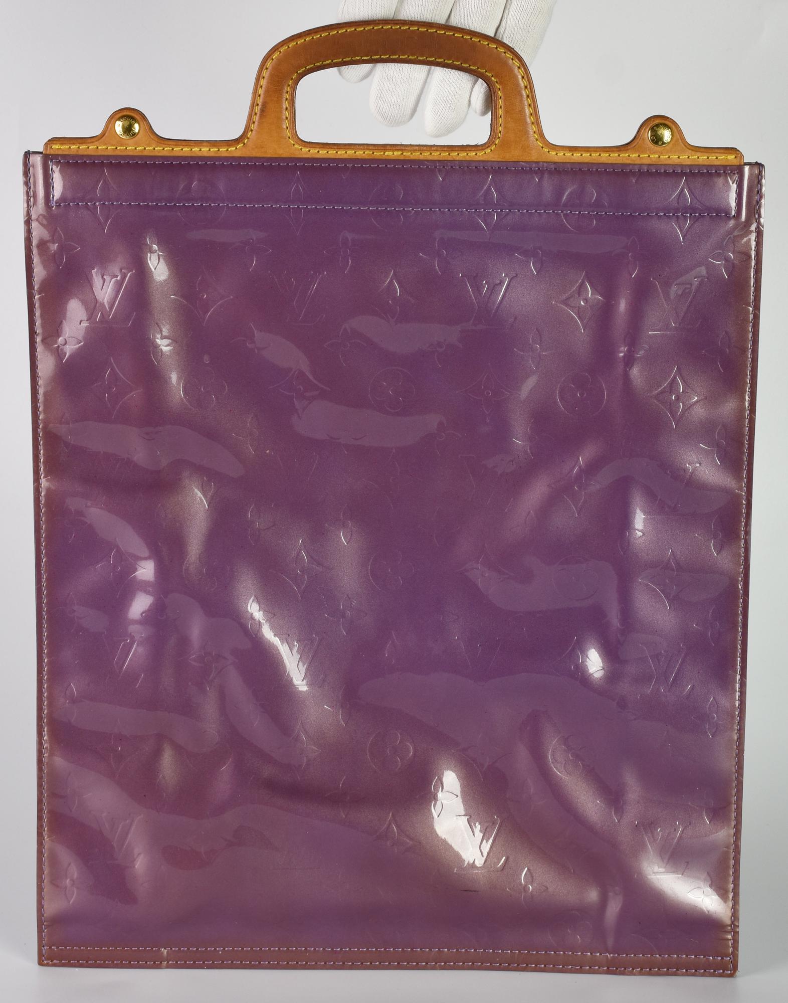 Louis Vuitton VERNIS STANTON PURPLE DESCRIPTION: Purple patent leather tote...