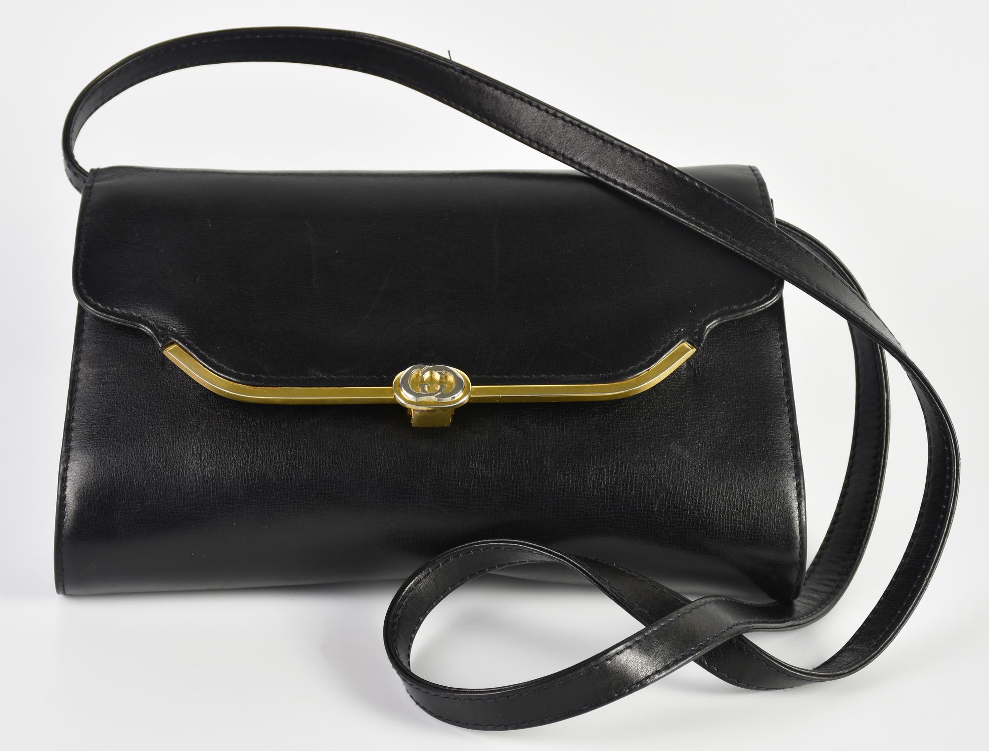 Gucci VINTAGE SHOULDER BAG DESCRIPTION: Vintage black leather crossbody bag....