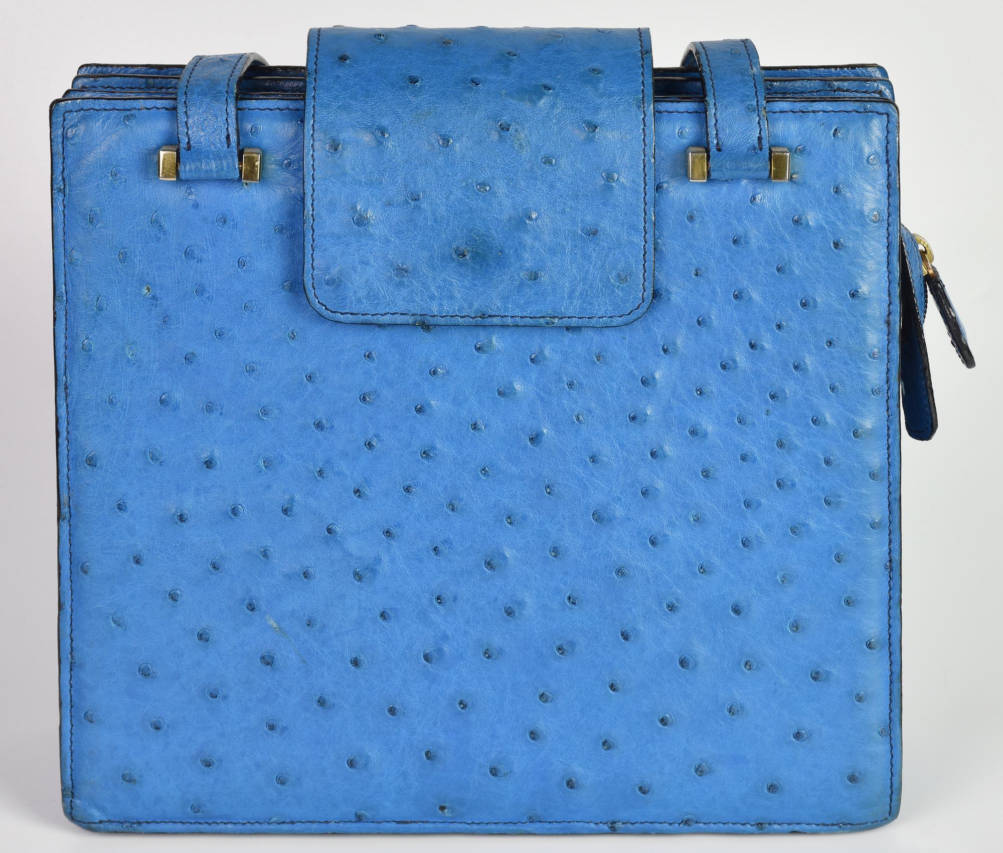 OSTRICH LEATHER BAG DESCRIPTION: Light blue ostrich leather bag with three...