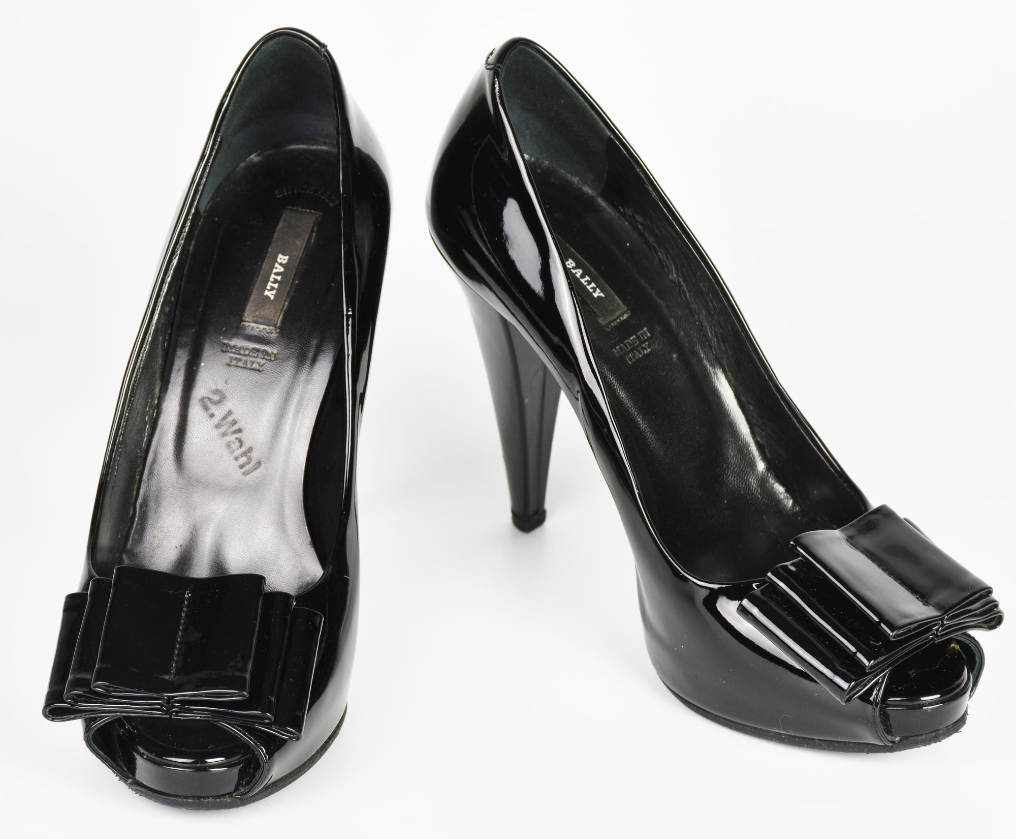 Bally OPEN TOE DESCRIPTION: Open toe black patent leather pumps with a bow at...