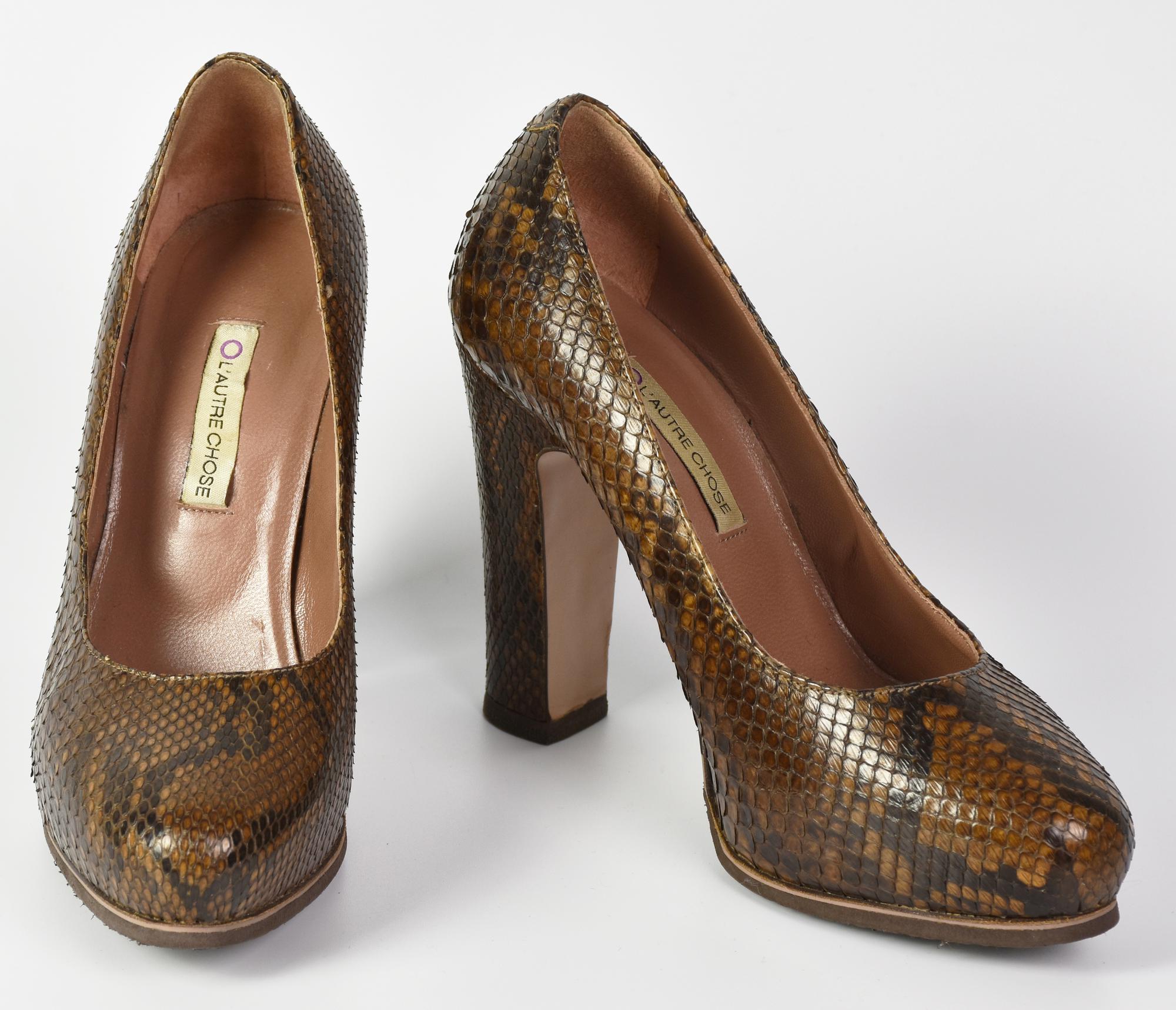 L'Autre Chose PUMPS DESCRIPTION: Python patterned pumps with internal...