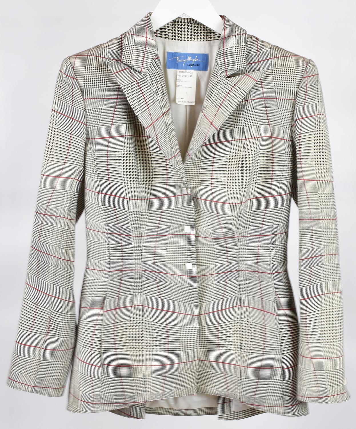 Thierry Mugler BLAZER DESCRIPTION: Fitted wool blazer with three buttons....