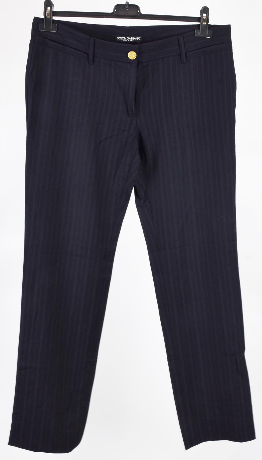 Dolce&Gabbana WOMAN TROUSERS DESCRIPTION: Wool trousers with a logo button....