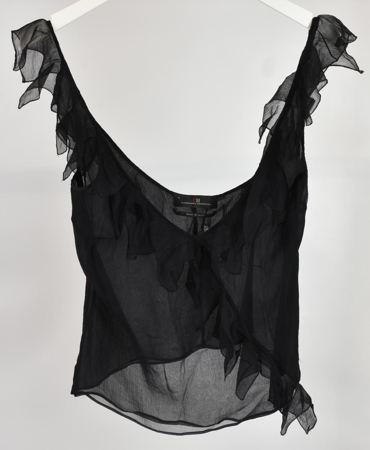 Carolina Herrera TOP DESCRIPTION: Transparent top with ruffle decoration....