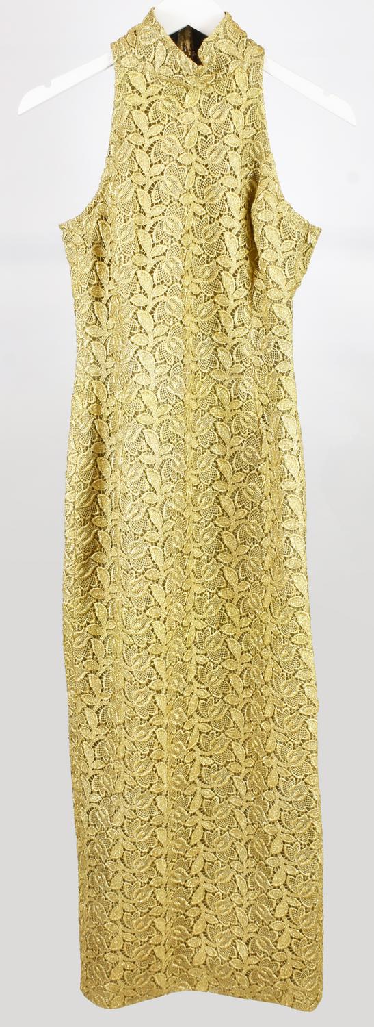 Versus By Gianni Versace EVENING GOWN DESCRIPTION: Golden dress with a halter...