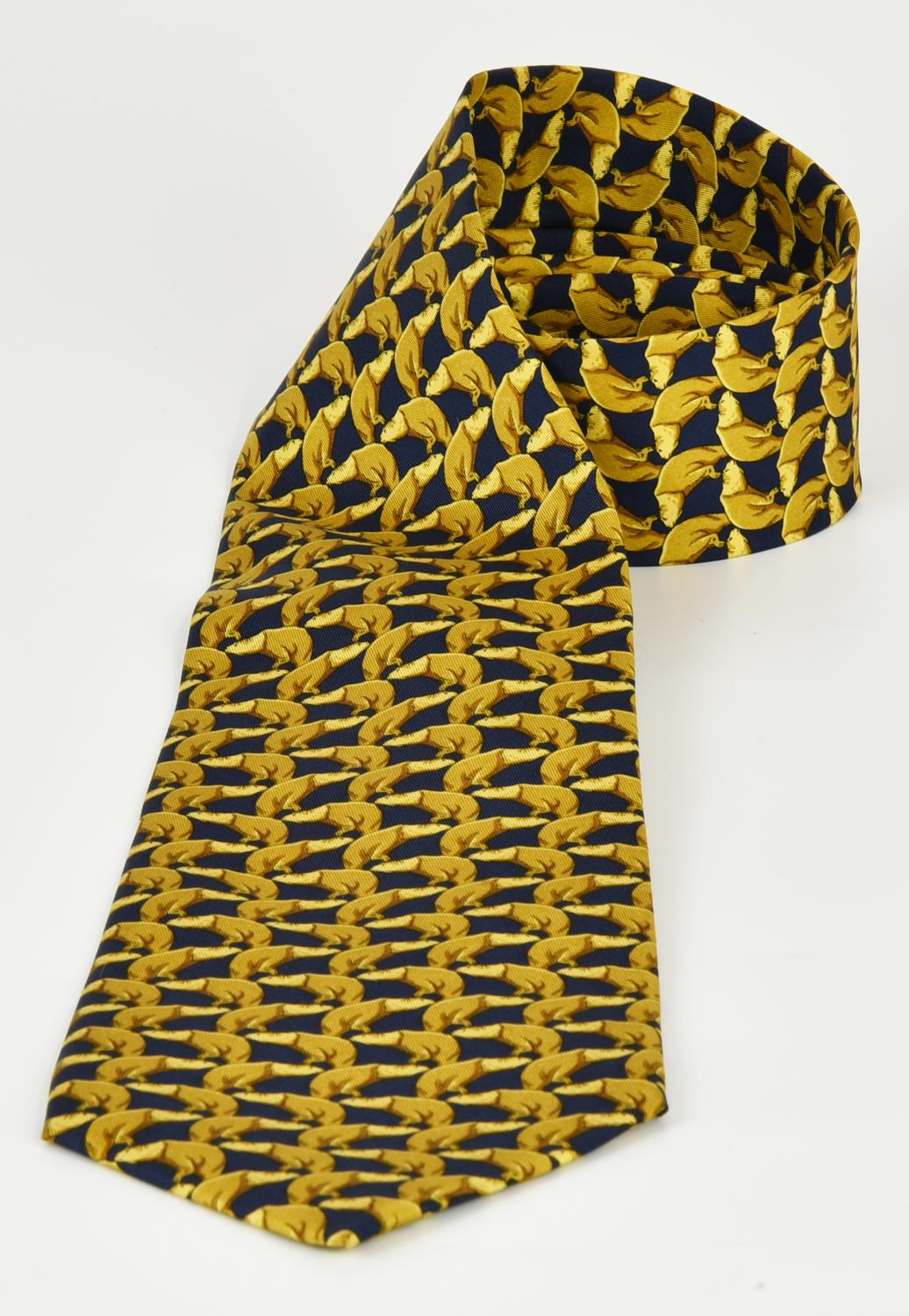 Gucci SILK TIE DESCRIPTION: A patterned silk tie in yellow and blue. Made in...