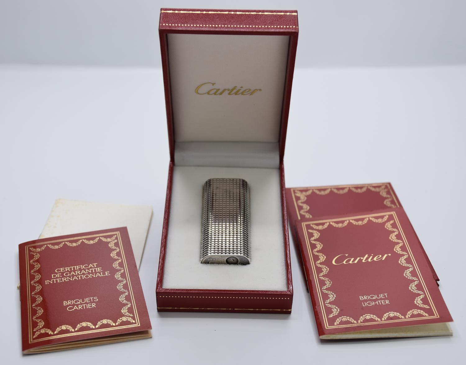 Cartier LIGHTER DESCRIPTION: Cartier silver-plated lighter. Serial number: E...