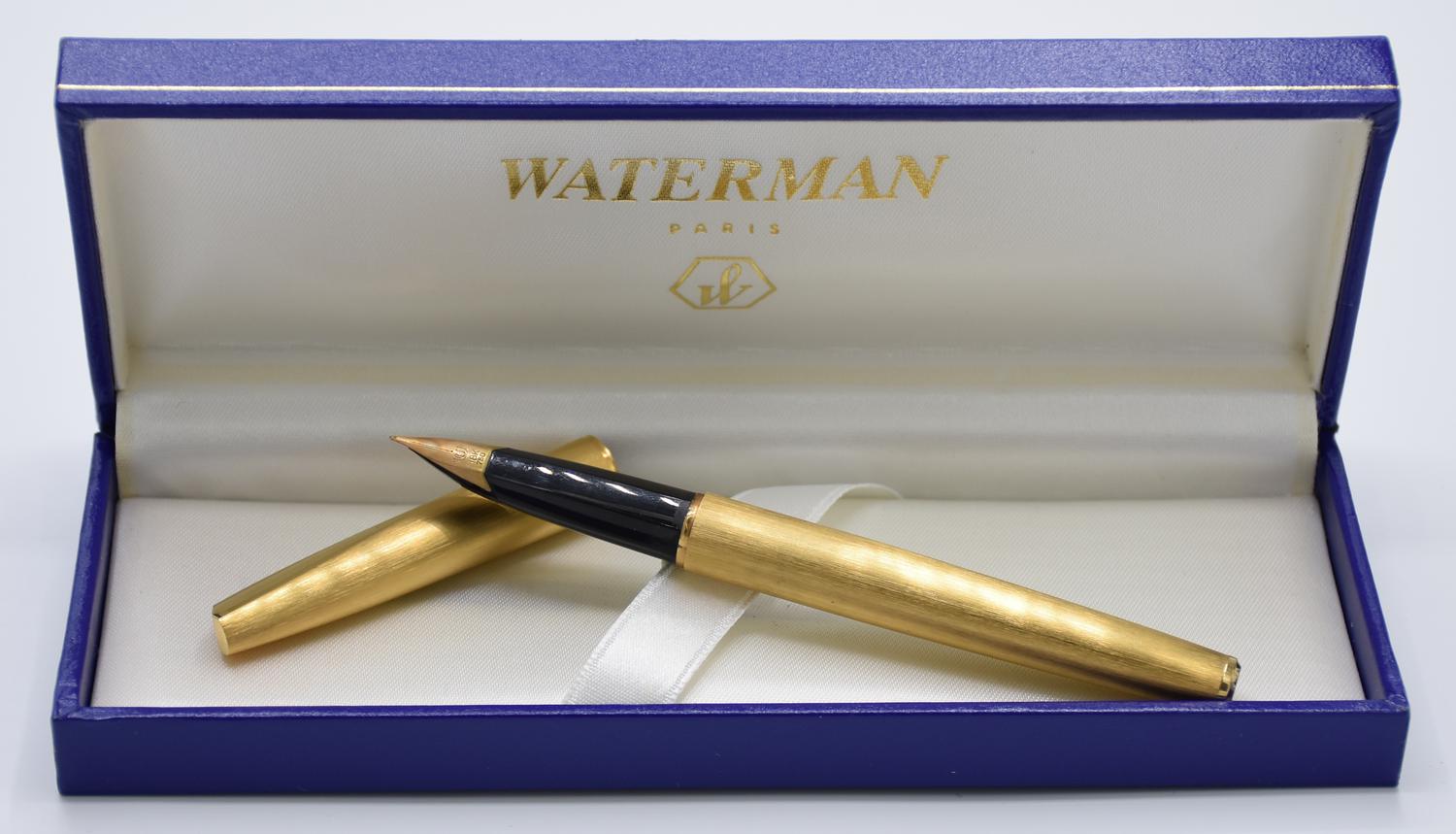 Waterman FOUNTAIN PEN DESCRIPTION: Gold-plated fountain pen with 18K gold...