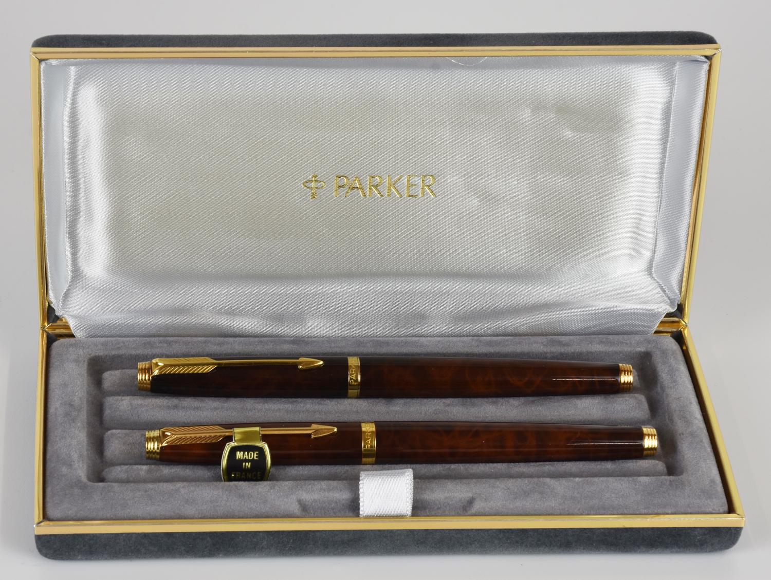 Parker SET OF TWO PARKER 75 LAQUE FOUNTAIN PEN DESCRIPTION: A pair of Parker...