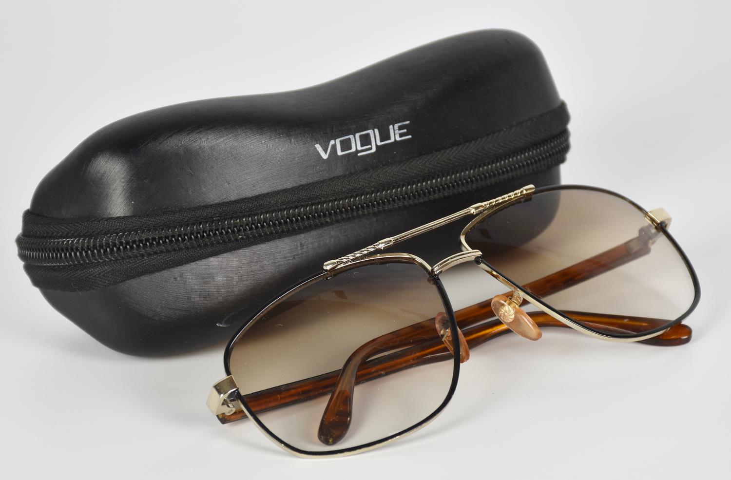 Vogue SUNGLASSES DESCRIPTION: Sunglasses with a metal frame and gradient...