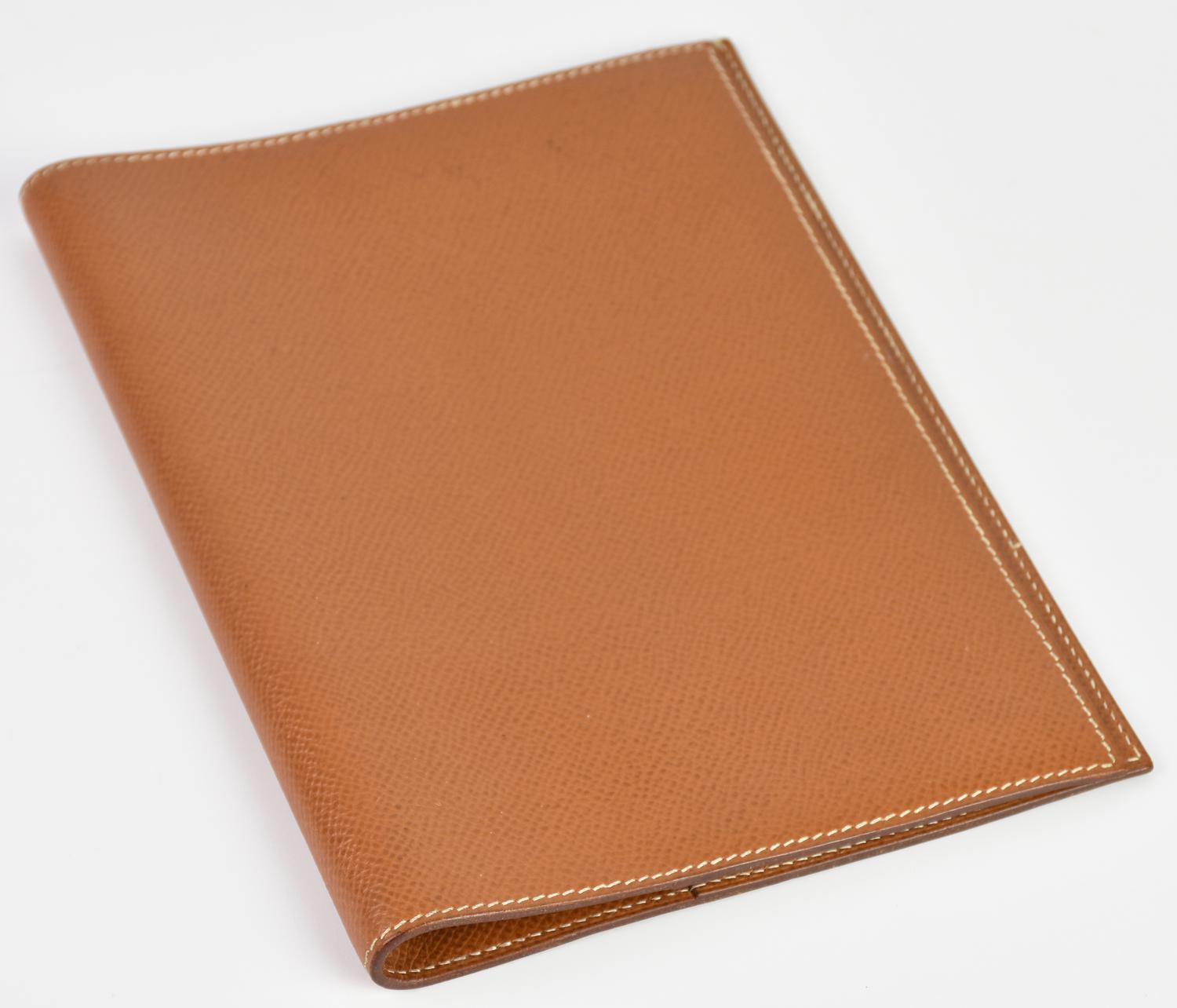 Hermes AGENDA HOLDER DESCRIPTION: Camel color embossed leather agenda holder....