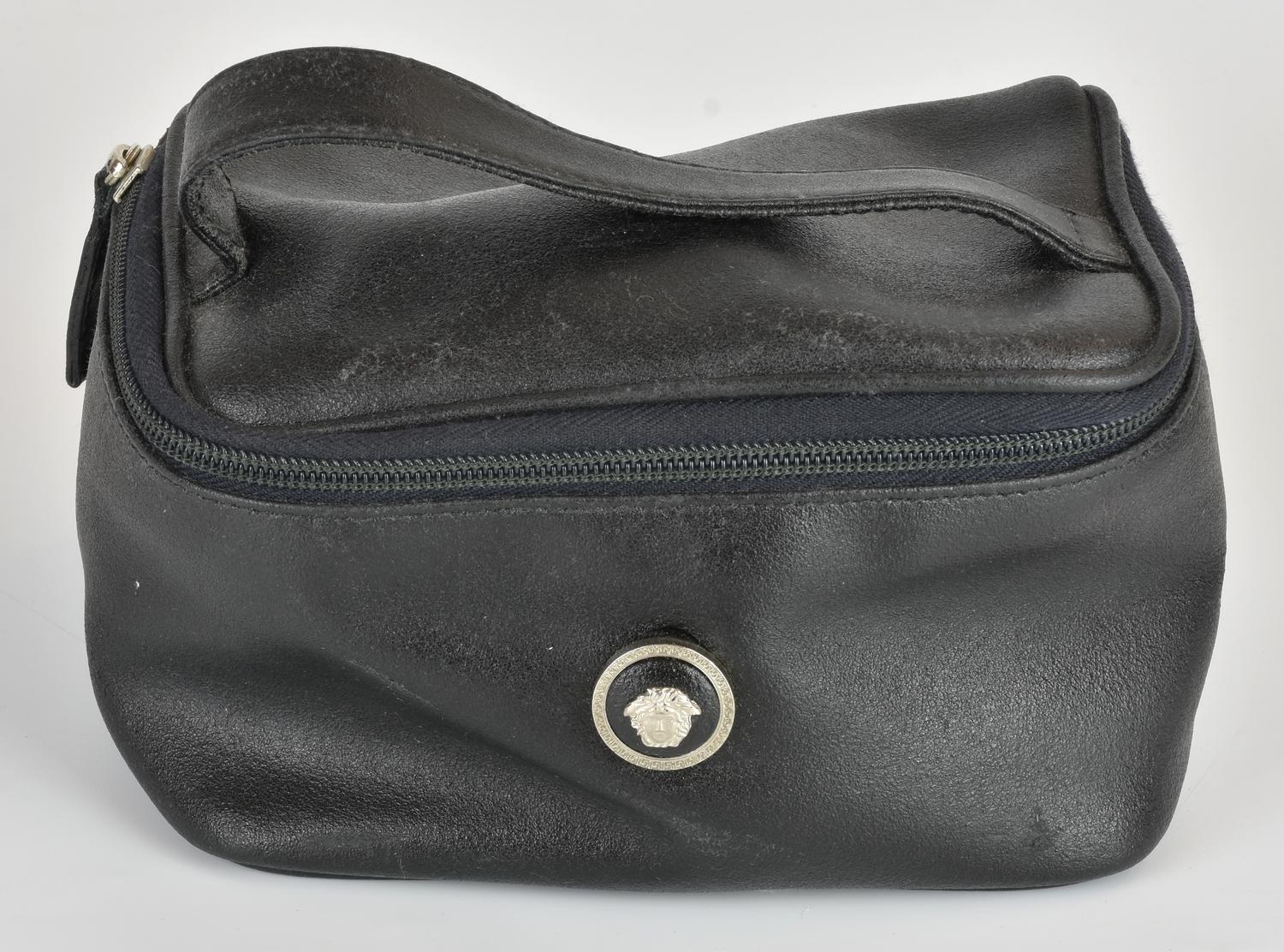 GIANNI VERSACE LEATHER TROUSSE DESCRIPTION: Black leather pouch with a metal...