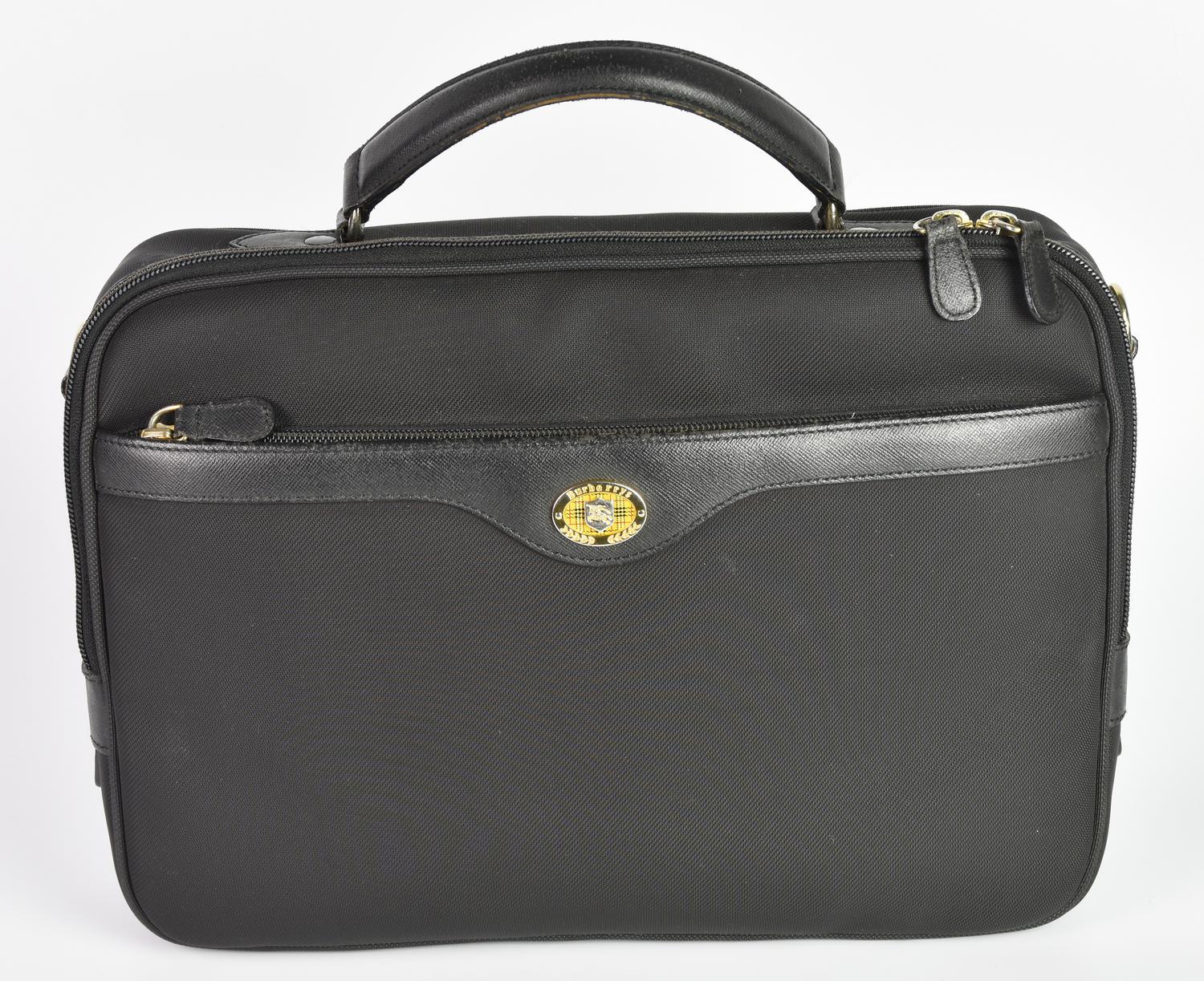 Burberry BRIEFCASE DESCRIPTION: Black fabric briefcase with leather inserts...