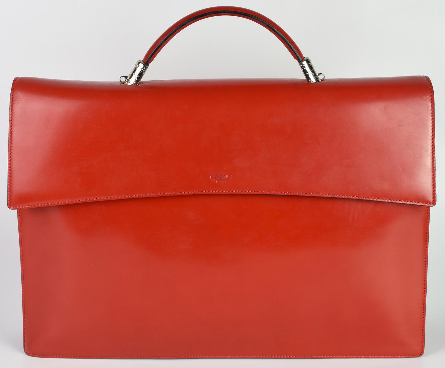 Celine BRIEFCASE DESCRIZIONE: Red leather briefcase with handle and magnetic...