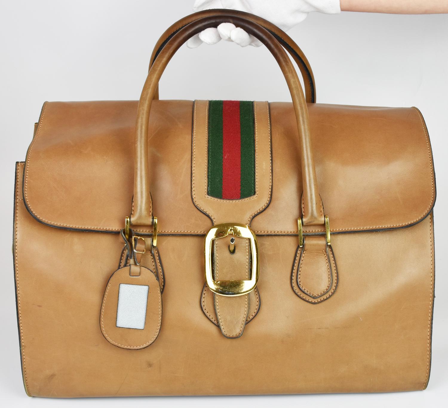 Gucci VINTAGE LEATHER SUITCASE DESCRIPTION: Leather suitcase with Web motif...