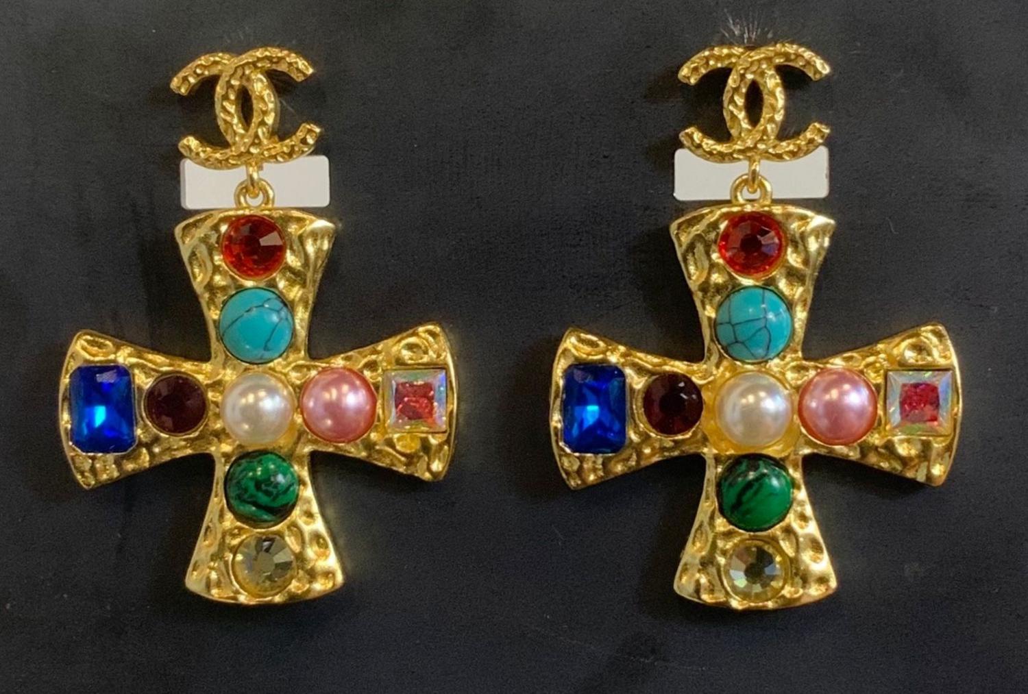 Chanel EARRINGS DESCRIPTION: Chanel earring. Golden metal cross with colored...