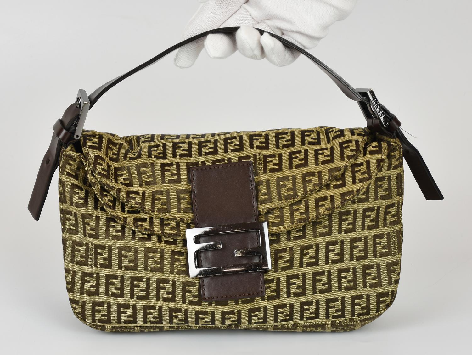 Fendi MAMMA BAGUETTE DESCRIPTION: Iconic shoulder bag in Zucchino monogram...