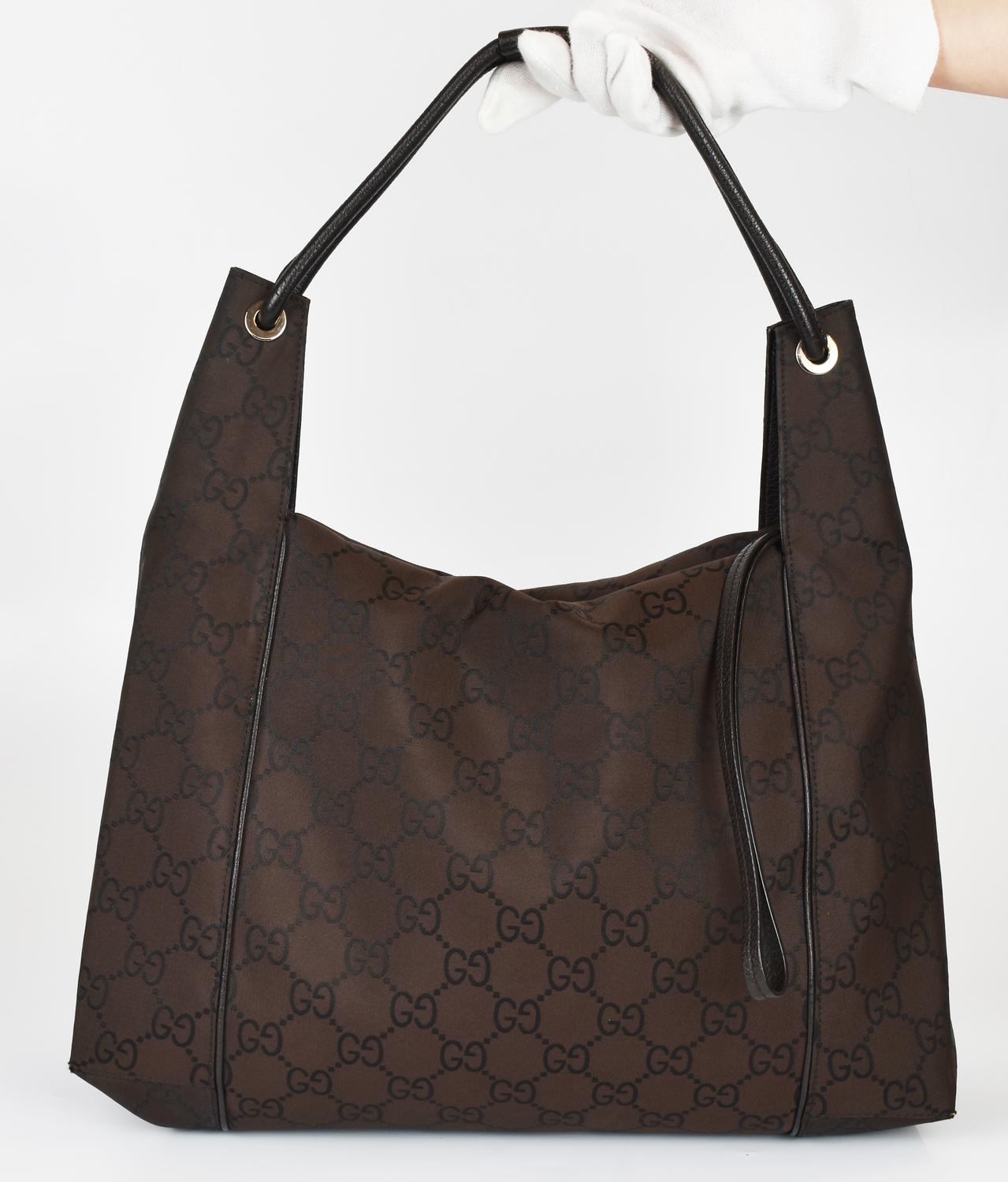 Gucci HOBO BAG DESCRIPTION: Shoulder bag in monogram canvas with leather...