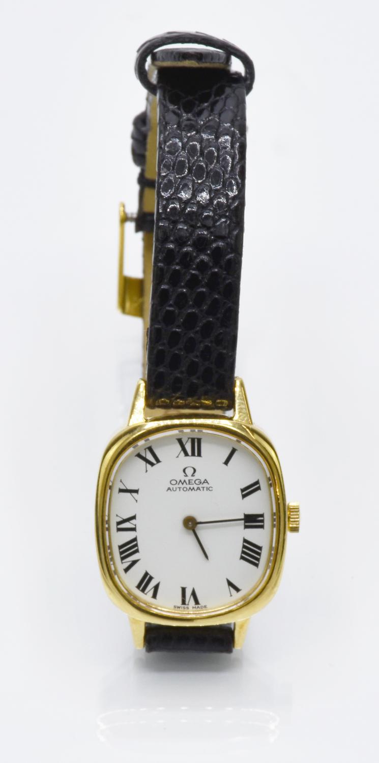 OMEGA LADY AUTOMATIC, CIRCA 1970s CASE: 18K gold, thickness 0.5 cm. Weight:...