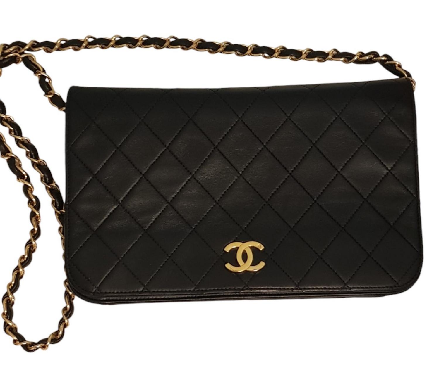 Chanel TIMELESS BAG DESCRIPTION: Timeless Chanel bag in black quilted calf...